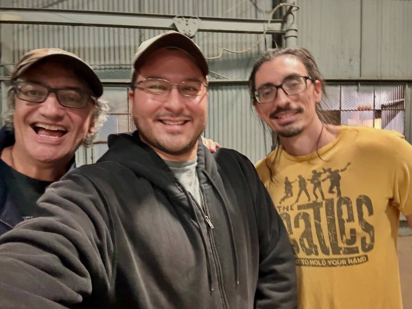 Photo of Marcos Butron, owner of Yellow Boom Media with two men working on a film